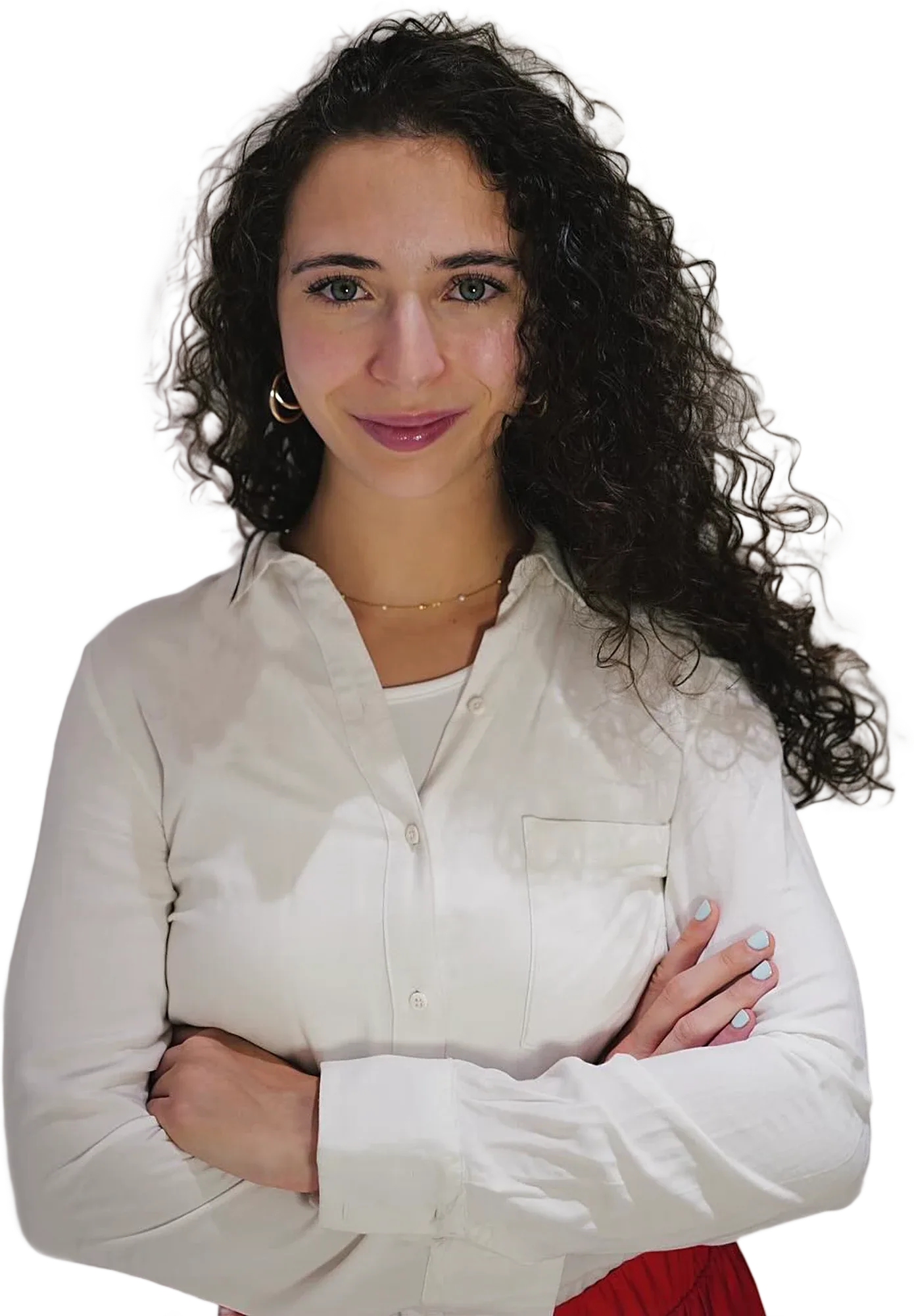 Teresa Villa in a white blouse, smiling, arms crossed