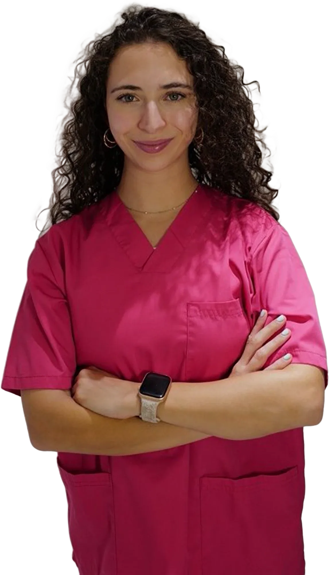 Teresa Villa, physiotherapist, smiling with her arms crossed, wearing pink scrubs