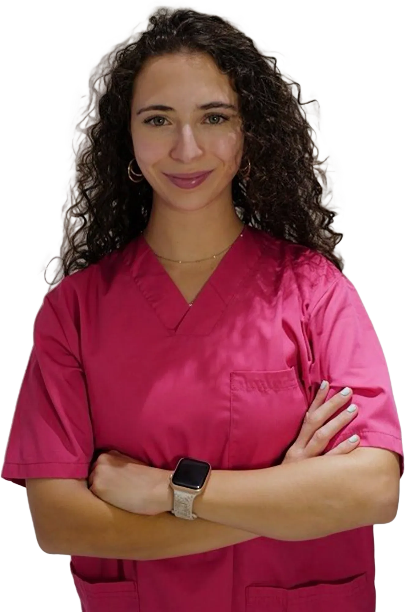 Teresa Villa, physiotherapist and Pilates instructor, in pink scrubs with her arms crossed